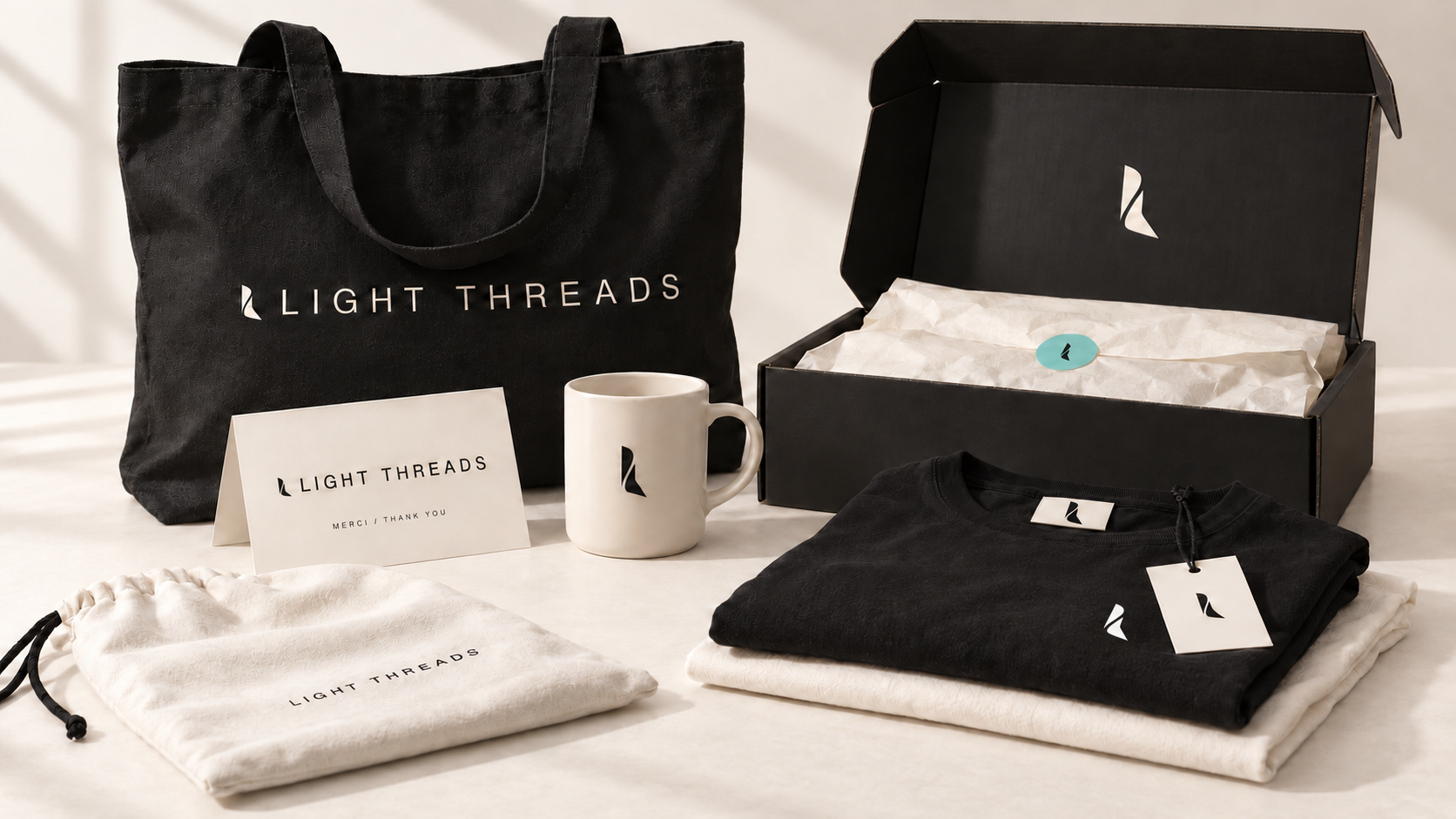 Light Threads ecosystem with clothing, tote, mug, card and packaging